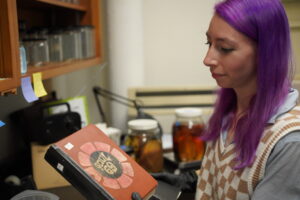 A woman holding a book.